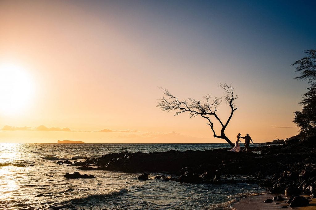 tips on how to plan your hawaii wedding_0010 - Ann Arbor Wedding Photographer silhouette of bride and groom on lava rocks in hawaii