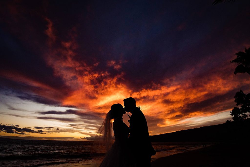 oceanfront maui wedding-angela-nelson-photography_0028 - Ann Arbor Wedding Photographer Angela Nelson Photography Bride and groom kissing at sunset