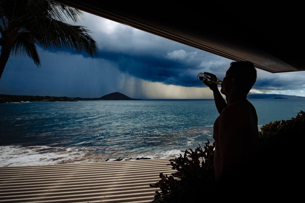 what if it rains on my wedding day_0001 - Ann Arbor Wedding Photographer Angela Nelson Photography Man drinks beer watching storm over ocean