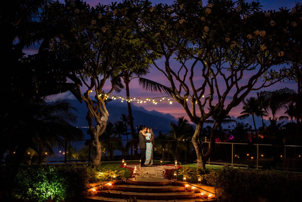 Zia & Sarah - Ann Arbor Wedding Photographer Angela Nelson Photography Couple kissing under string lights at Four Seasons Maui